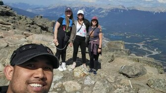 family at the top of a mountain